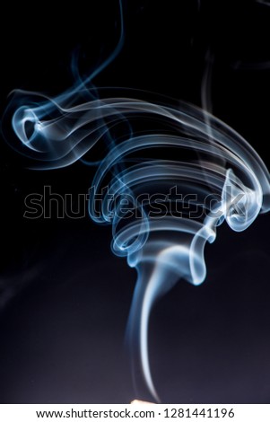 white smoke on black background. artistic abstract