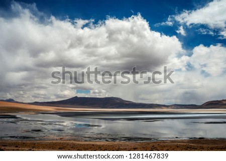 image of the atacama desert with some clouds in the sky