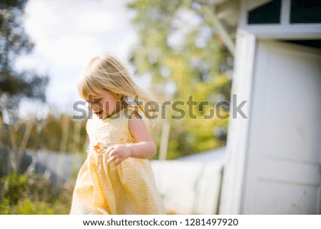 Little girl running outside