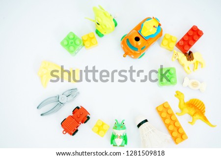 Baby kids toys frame on white background. Top view, flat lay                    