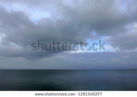 Sea under the cloudy sky