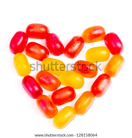 Colorful jelly candy love note in shape of heart isolated on white