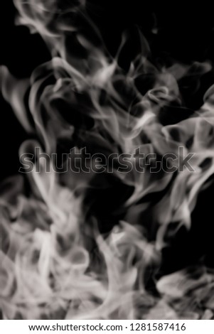 white smoke flame on a black background