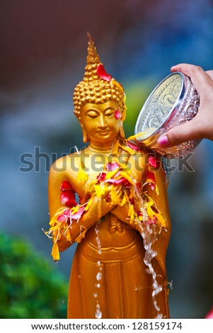 Watering of Buddha in Thailand.
