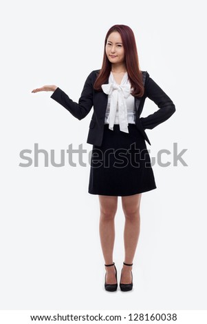 Asian business woman indicate blank space isolated on white background.