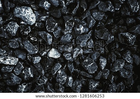 Coal images arranged on the floor for background. Black coal dug from mines for use as fuel for coal industry. The concept of industrialization in the old era that created air pollution.