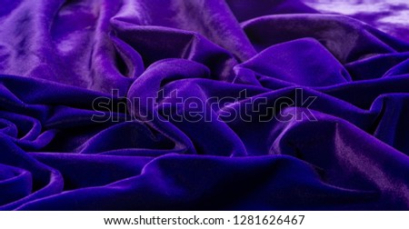 Picture. Texture, background. The velvet fabric is blue, the rich, rich color and luster of this luxurious velvet will add sophistication to any design style..