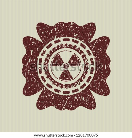 Red nuclear, radioactive icon inside distress with rubber seal texture