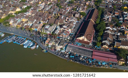 Panorama of Hoi An market with text "Cho Hoi An" in Vietnamese means HoiAn market. Royalty high-quality free stock photo image top view of Hoai river and boats traffic in Hoi An market, Vietnam