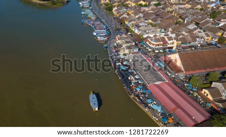 Panorama of Hoi An market with text "Cho Hoi An" on the wall in Vietnamese means HoiAn market. Royalty high-quality free stock photo image top view of Hoai river and boats traffic in Hoi An, Vietnam
