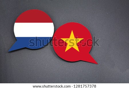 Netherlands and Vietnam flags with two speech bubbles on dark gray background