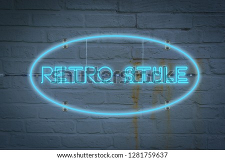 Leon lighton the wall with the word RETRO STYLE