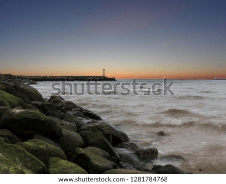 Sunset landscape photo of Baltic sea, rocks