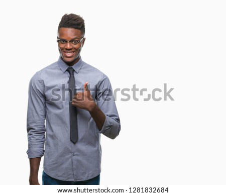 Young african american business man over isolated background doing happy thumbs up gesture with hand. Approving expression looking at the camera with showing success.
