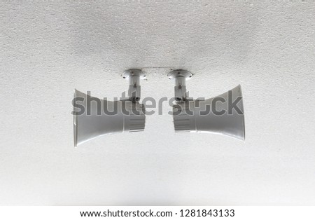 loudspeaker on the cement wall background
