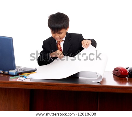 unhappy young businessman tearing off the pattern