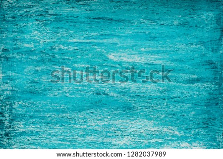 Bright mid-tone heterogeneous turquoise background with streaks of aquamarine and white, natural wood texture.