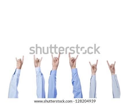 Close up image of different hands gesturing rock and roll sign against white background