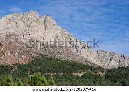 Landscape with mountains in a gree valley