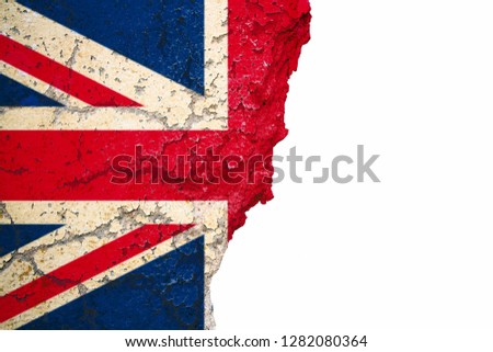 United Kingdom UK flag painted on cracked split peeling paint brick wall cement facade on white. Concept image for Great Britain, British, England, Brexit, Hard Brexit No Deal.
