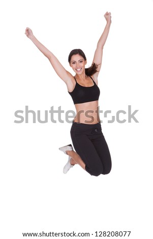 Excited Sporty Woman Jumping. Isolated On White