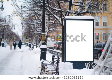 Vertical mock-up of city poster winter city with thick edges, blank white billboard in urban settings, empty street information placeholder on sidewalk with copy space for logo, advertising