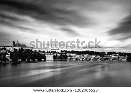 A view to prague castle  and the Charles Bridge - beautiful site in europe  long time black and white photography