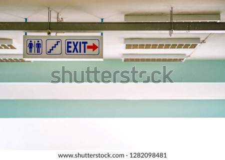 Sign of toilet, stair and exit on white background of building