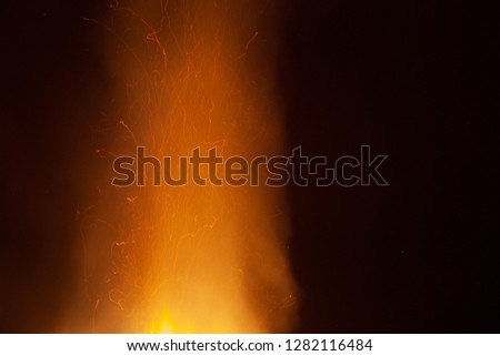 Sparks of the traditional nocturnal bonfire of the epiphany, Vittorio Veneto, Italy