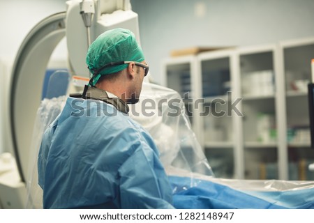 interventional cardiology endovascular treatment, percutaneous balloon angioplasty or rotablation with stent for coronary stenosis cardiovascular procedure Royalty-Free Stock Photo #1282148947