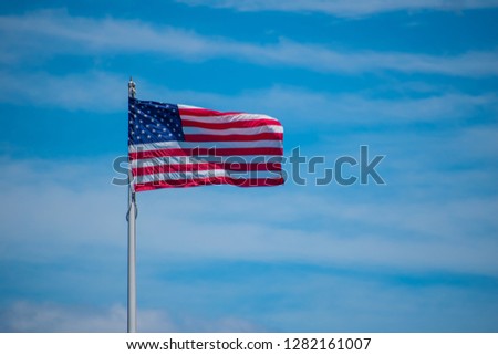 American flag blowing in the wind at Patterson great falls
