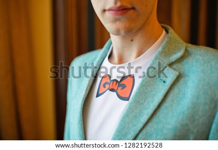 a man with a bow tie drawn
