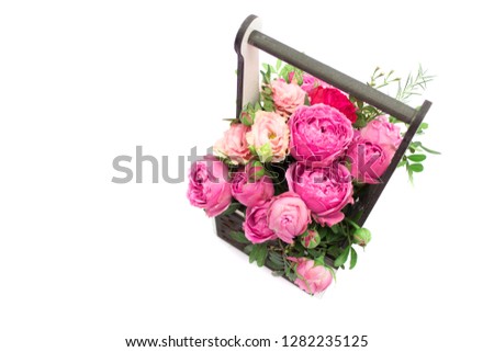 A bouquet of flowers in a gift box box, Booker of roses for mother's day. Roses in a gift box. Flowers on March 8. Happy women's day. Bouquet for a birthday.