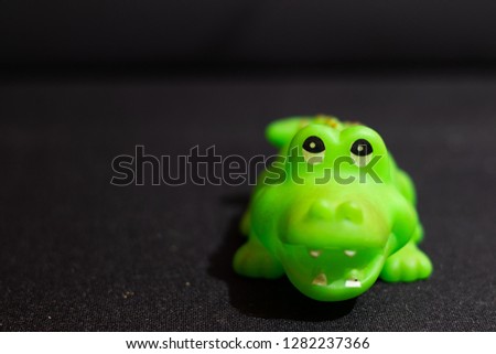 Toy crocodile with background