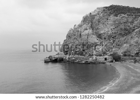 rock on a coast a white photo is black