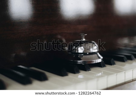close up bell on the piano background