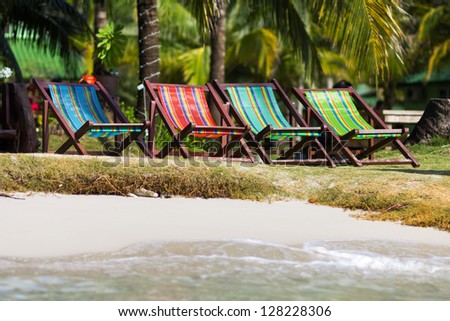 Colorful deckchairs on the beach of tropical island, Thailand