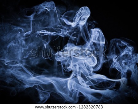 A thick blue twirling smoke pattern in front of a black background with a slight vignette border/drifting smoke overlay or texture design. 