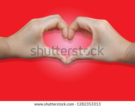 Heart shape of two hand put on red background