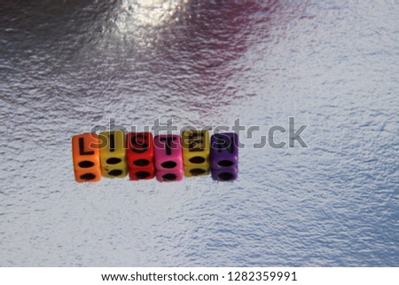 Listen word spelled alphabet blocks 3d message in primary color abc beads.