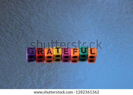 Grateful thank you word spelled alphabet blocks 3d message in primary color abc beads.