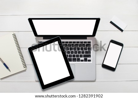 top view tablet computer notebook on background wood