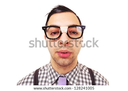 Funny portrait of young nerd with eyeglasses isolated on white background.