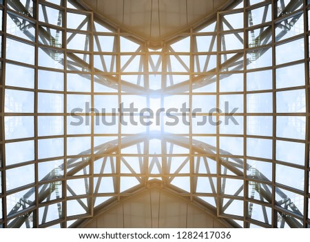 Structure of metal ceiling with shining light and blue sky