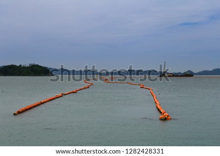 Turbidity curtain used at this construction site along the inter-coastal waterway to trap silt and sediment and keep it from polluting the water during excavations
 Royalty-Free Stock Photo #1282428331