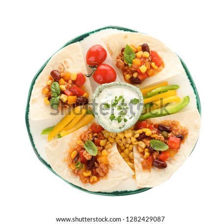 Plate of tortillas with chili con carne on white background, top view