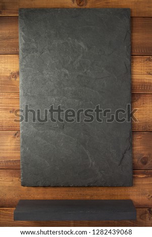 slate stone at wooden background texture surface