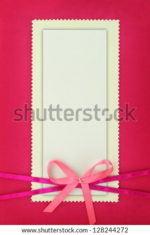 Empty card on pink fabric texture