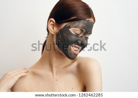 young woman in cosmetic clay mask care