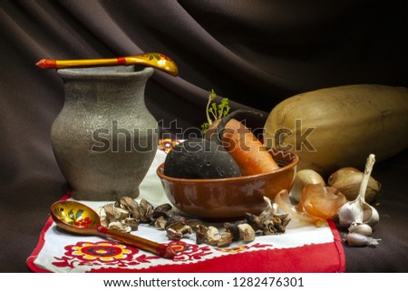 Traditional Russian cuisine. On a brown background, rustic dishes. Close-up